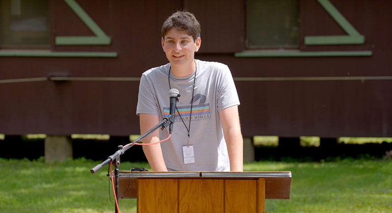 jack zislis speaking at podium